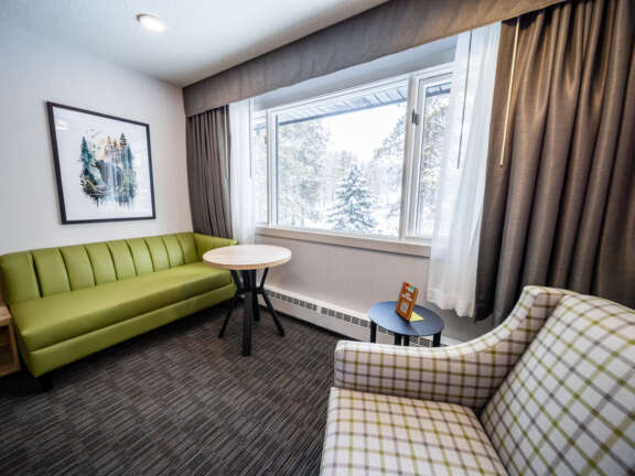 King bed room in the Main Lodge at Mountaineer Lodge, Lake Louise, steps from the lobby and hot tub.