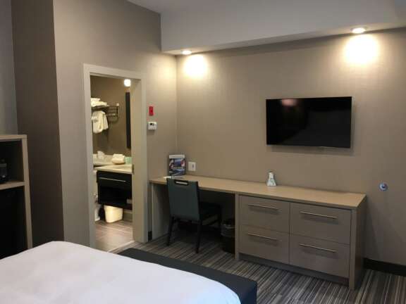 Queen room in the Timber Building at Mountaineer Lodge, Lake Louise, close to ski storage and breakfast room.