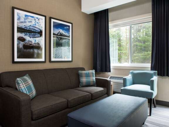 One Queen Room with Sofa Bed at Mountaineer Lodge, Lake Louise, Timber Building, sleeps four.