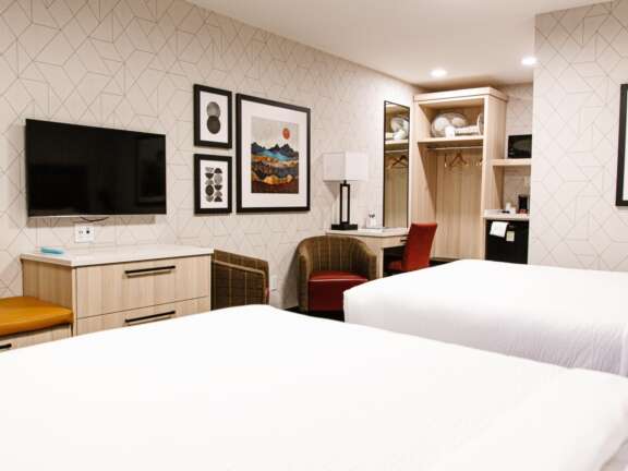 Two queen beds in the Timber Building at Mountaineer Lodge, Lake Louise, best value room.