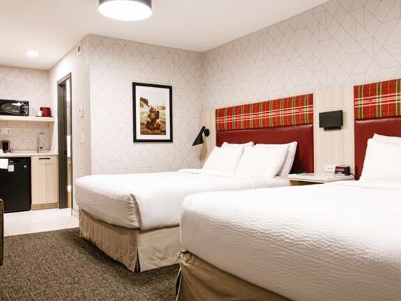 Two queen beds in the Timber Building at Mountaineer Lodge, Lake Louise, best value room.
