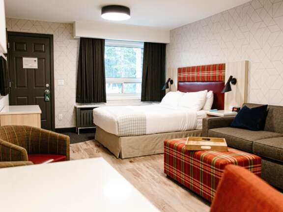Dog Friendly: Pet-friendly hotel room at Mountaineer Lodge, Lake Louise, ground floor with exterior access in the Timber Building.