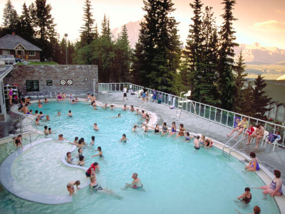 Birds's eye view of guests from the Mountaineer Lodge enjoying a rejuvenating soak in the Banff Hot Springs.