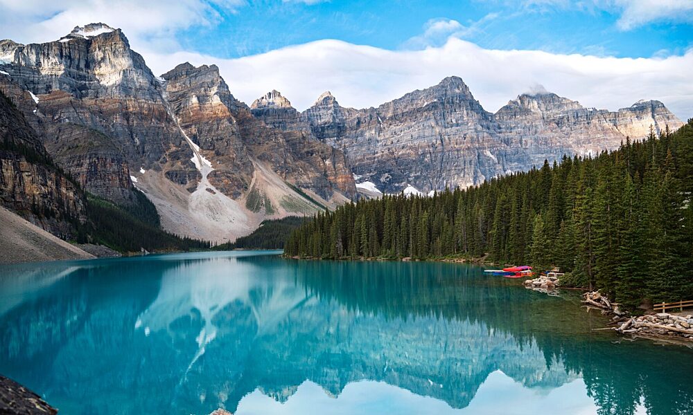 Beautiful Blue Moraine Lake in Banff National Park. Wondering where to stay? Book a getaway at Mountaineer Lodge in Lake Louise.