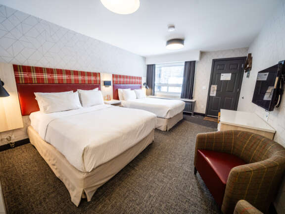 Mountaineer Lodge Two Queen Hotel Room in Rocky Mountain Accommodations Lake Louise Alberta
