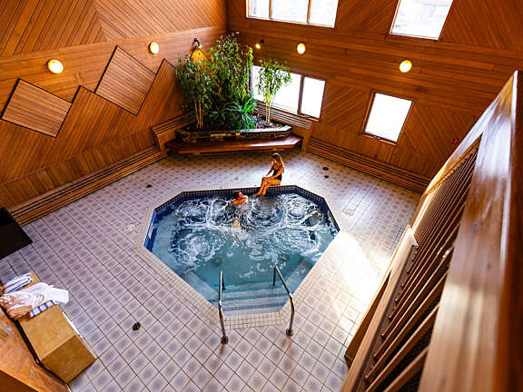 A relaxing soak in the hot tub at Mountaineer Lodge will soothe your sore muscles and help you relax into a great sleep in your cozy room.